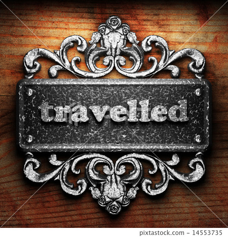 travelled word of iron on wooden background 14553735