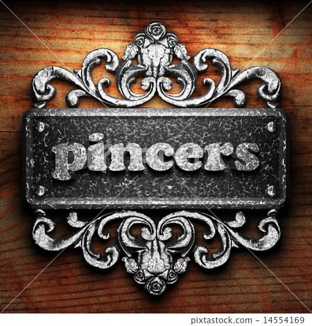 pincers word of iron on wooden background pincers word of iron on wooden background 14554169