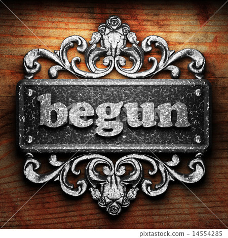 begun word of iron on wooden background 14554285