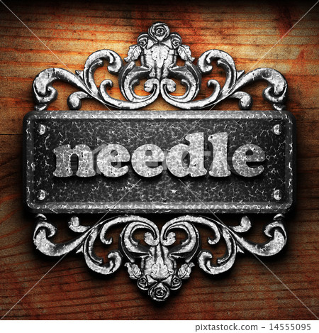 needle word of iron on wooden background 14555095