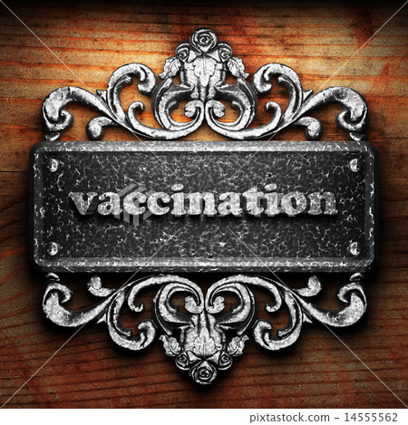 vaccination word of iron on wooden background 14555562