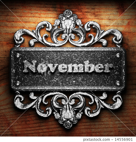 November word of iron on wooden background 14556901