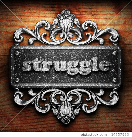 struggle word of iron on wooden background 14557933
