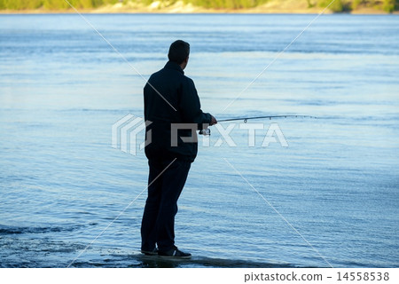 Modern clean fishing rod in hands Modern clean fishing rod in hands 14558538