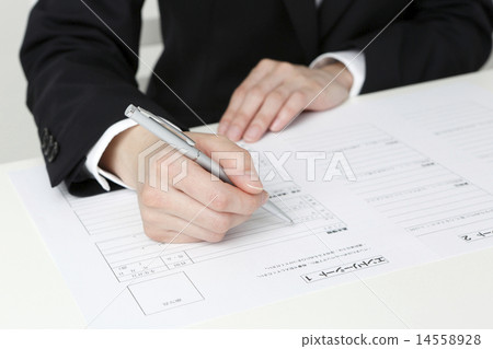 Women's hand filling entry sheet 14558928