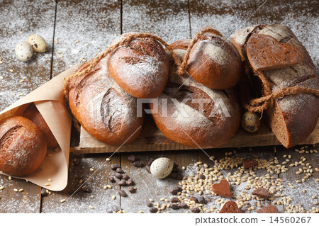 Variety of rye bread on a wooden background Variety of rye bread on a wooden background 14560267