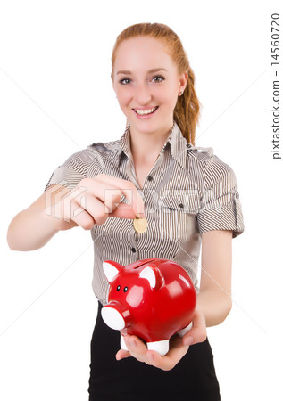 Redhead with piggybank isolated on the white Redhead with piggybank isolated on the white 14560720