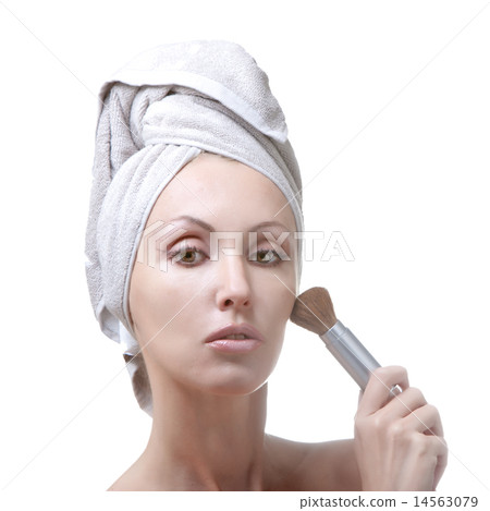 young woman in towel with a cosmetic brush 14563079