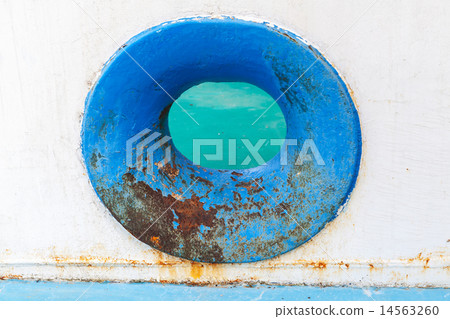 Empty blue hawse in old rusted ship hull 14563260