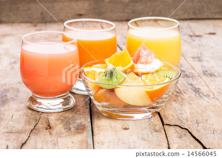 Fresh juice with fruit salad in glass dish Fresh juice with fruit salad in glass dish 14566045