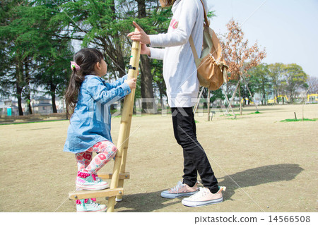 Parent-child practicing stilts Parent-child practicing stilts 14566508