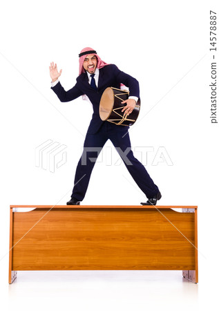 Arab businessman playing drum on desk Arab businessman playing drum on desk 14578887