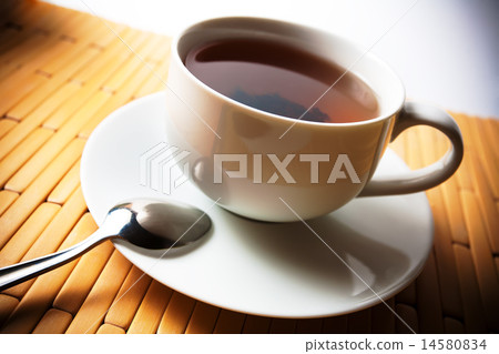 white cup of tea on a bamboo background white cup of tea on a bamboo background 14580834