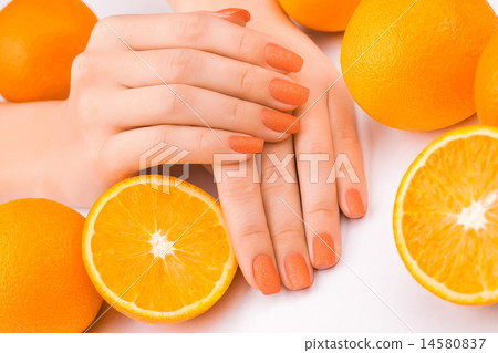 orange manicure with oranges. on the white 14580837