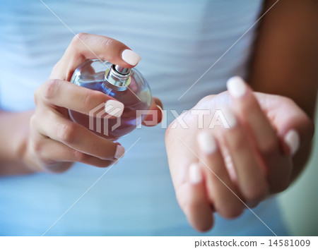 bride applying perfume on her wrist 14581009