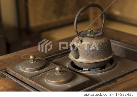 Iron bottle in the hearth 14582433