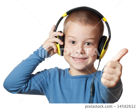 Young boy in headphones 14582612