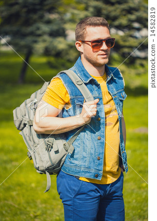 Handsome man in the green park Handsome man in the green park 14582819