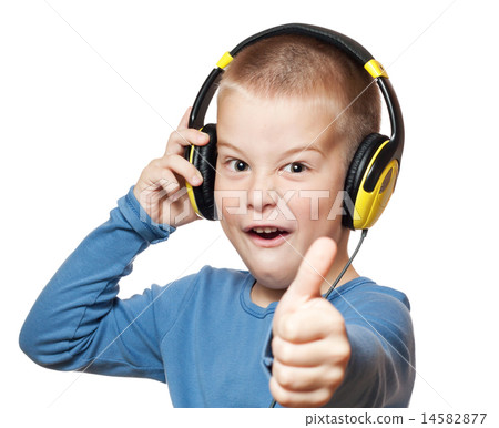 Young boy in headphones 14582877