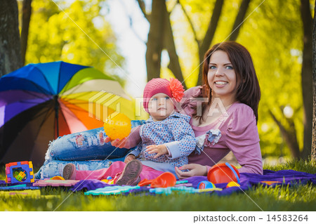 Happy mother and baby on the meadow Happy mother and baby on the meadow 14583264