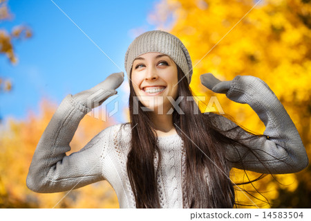 cheerfu woman on a autumn sky background 14583504
