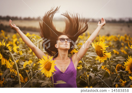 happy woman in a sunflower's field happy woman in a sunflower's field 14583858