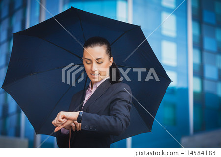 businesswoman, on the modern building background 14584183
