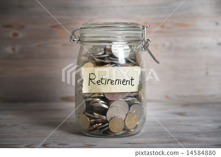 Money jar with retirement label. 14584880