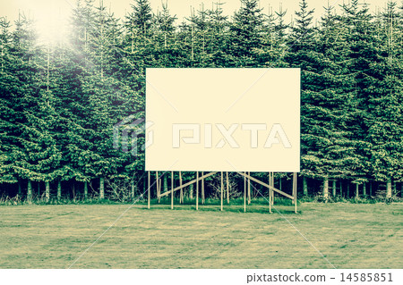 Big billboard sign surrounded by trees 14585851