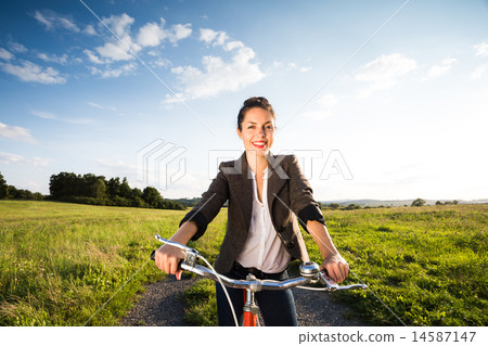 Beautiful young woman on retro orange bicycle Beautiful young woman on retro orange bicycle 14587147