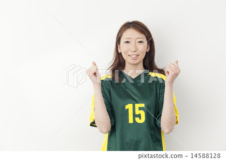 A young lady wearing a football uniform A young lady wearing a football uniform 14588128