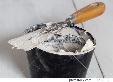 Spatula with plaster and mixing tub Spatula with plaster and mixing tub 14589666