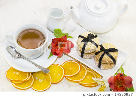 cookies and tea on a table in a restaurant 14590957