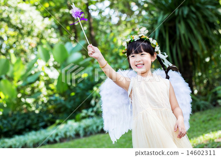 Little cute girl in angel dress in the park Little cute girl in angel dress in the park 14602311