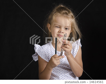 Disheveled girl looks at compass 14614561