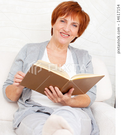 Adult woman reading book Adult woman reading book 14617154