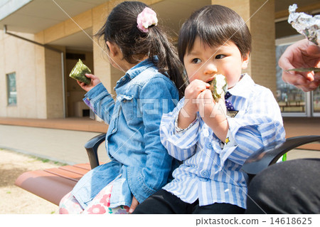 Brothers are eating rice balls Brothers are eating rice balls 14618625