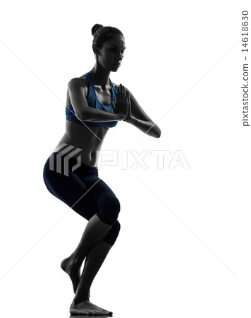 woman exercising yoga eagle pose silhouette 14618630