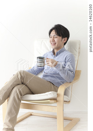 A man relaxing in a chair 14620160