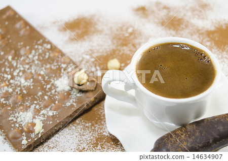 Cup of coffee and a chocolate in the background 14634907
