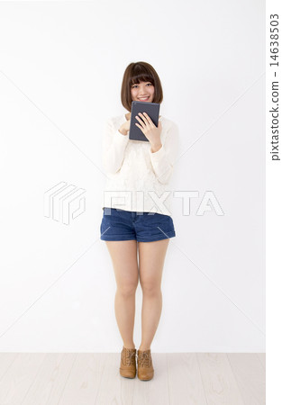A woman with a tablet 14638503