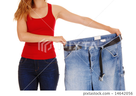 Woman holding big pants. Woman holding big pants. 14642056