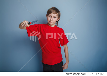 boy teenager European appearance in a red shirt brown hair looks boy teenager European appearance in a red shirt brown hair looks 14647465