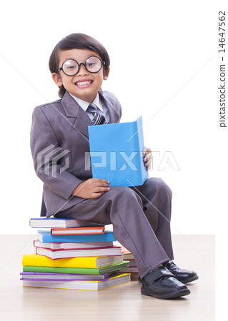 Cute boy in suit reading a book 14647562