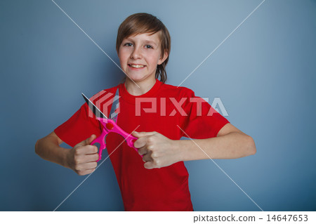 boy teenager European appearance in a red shirt holding a brown  14647653