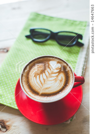 Red coffee latte art cup and glasses on wood Red coffee latte art cup and glasses on wood 14647663