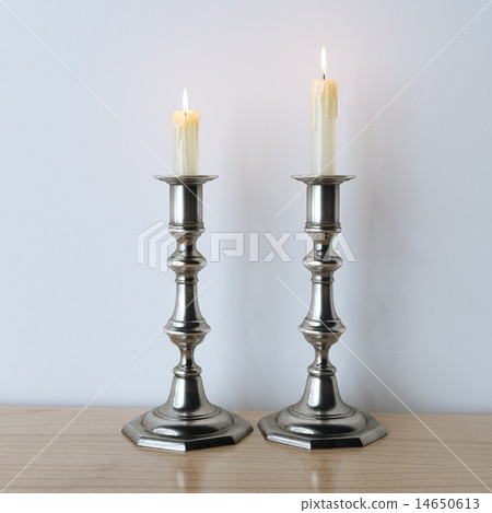 Retro candelabra with burning candles on table Retro candelabra with burning candles on table 14650613