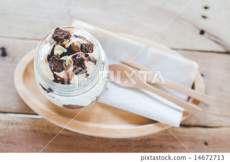 Brownie banoffee in glass on wooden table. 14672713