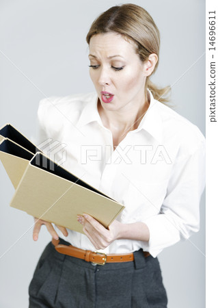 Business woman juggling folders Business woman juggling folders 14696611