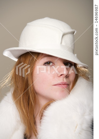 Redhead serious in white felt hat and fur Redhead serious in white felt hat and fur 14696987